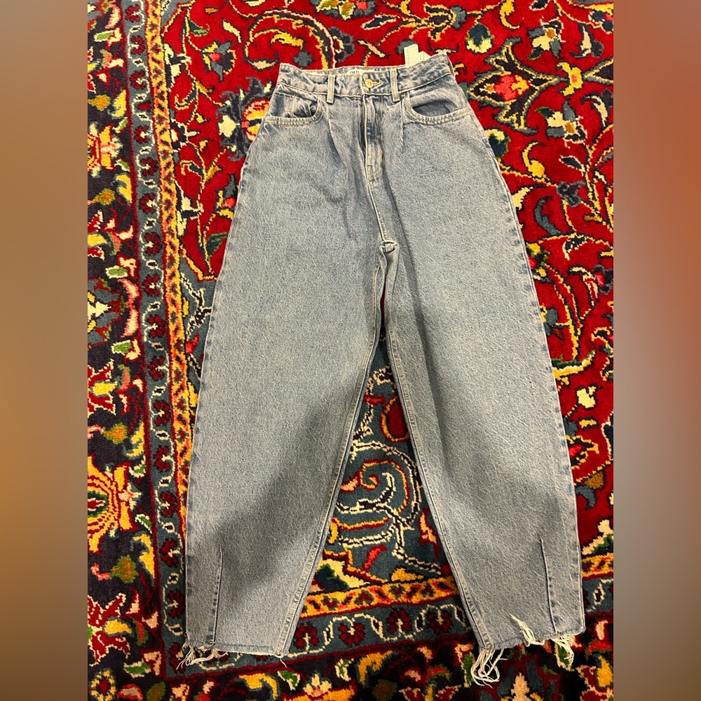 Zara size small blue jeans tight waist wider on legs ripped at bottom